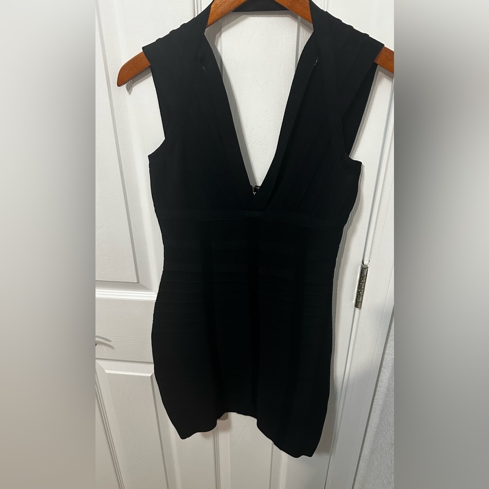 Black , stretch , mini dress, with zipper back and cut outs